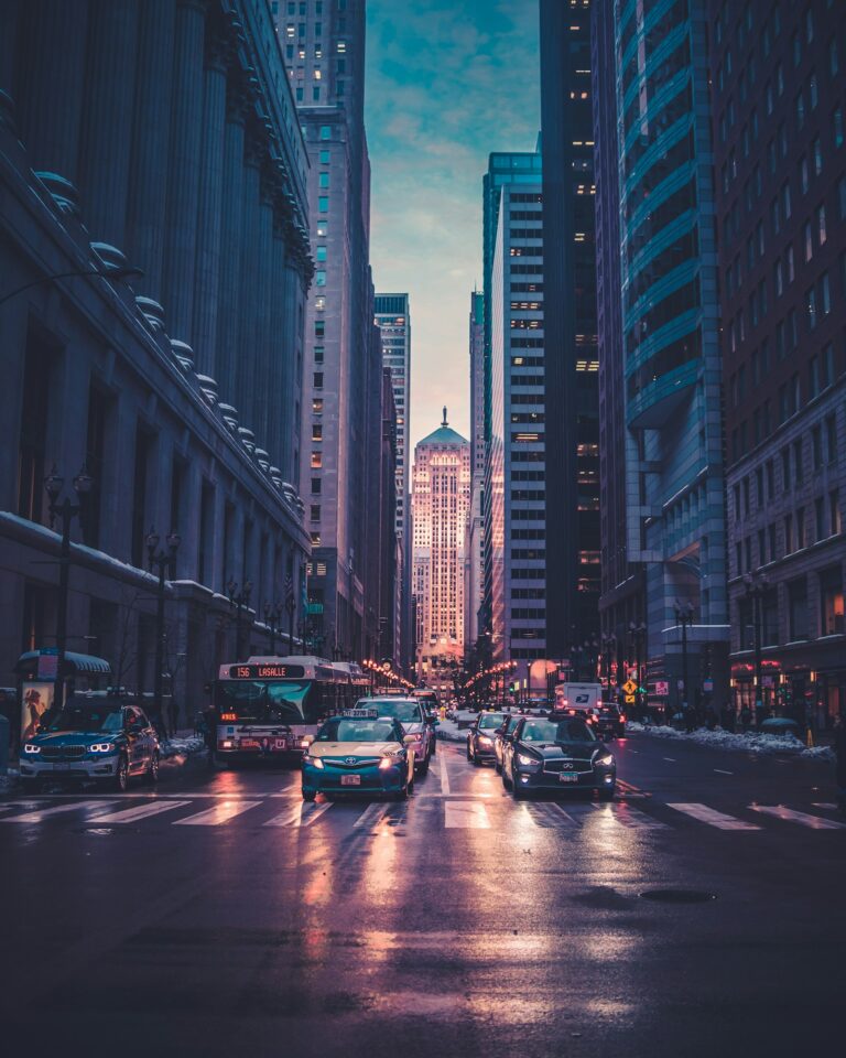 Empty city streets at night under a dark sky